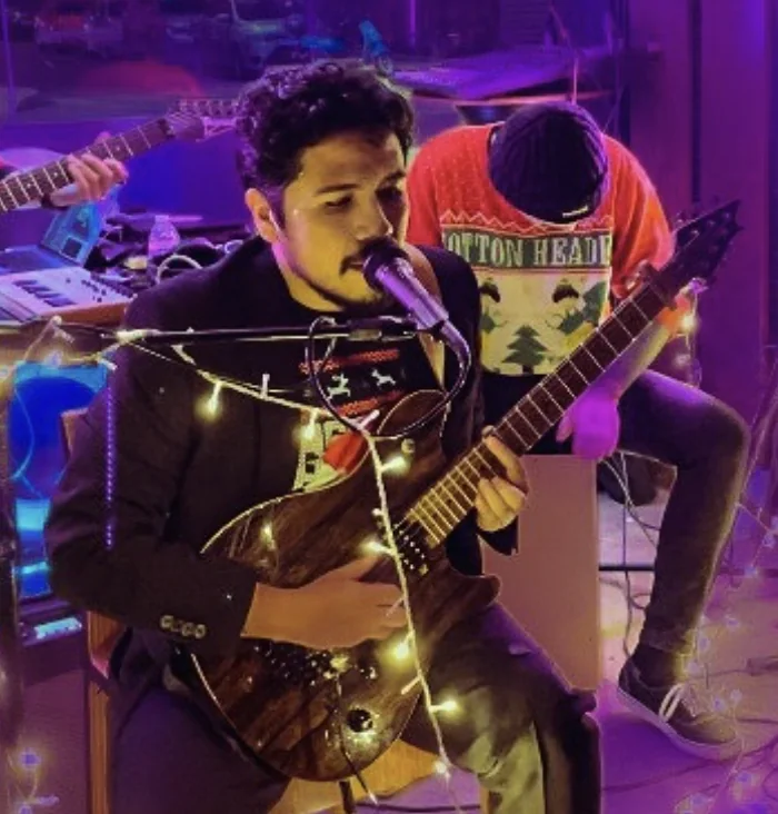 Alexis Soubran singing and playing guitar with Cavane